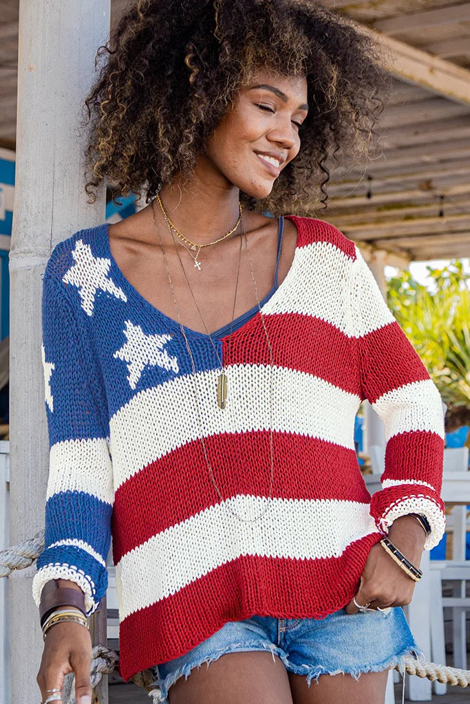 Woman in v-neck flag sweater