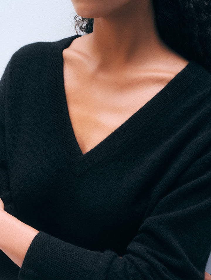 Black White & Warren cashmere V-neck sweater, cozy top with a classic V-neckline, shown on a model.