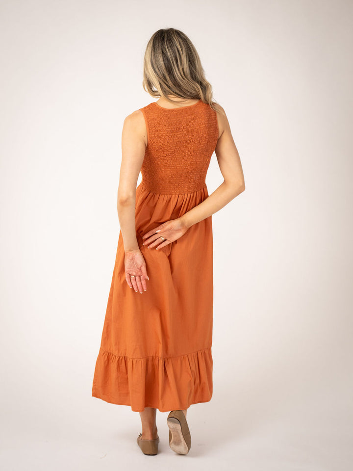 Beau and Ro Margot Persimmon Dress featuring a vibrant orange color and stylish silhouette, perfect for casual or dressy occasions.