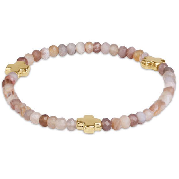 Enewton Signature Cross Gemstone Bracelet in gold-tone metal, close-up view of cross charm and gemstones