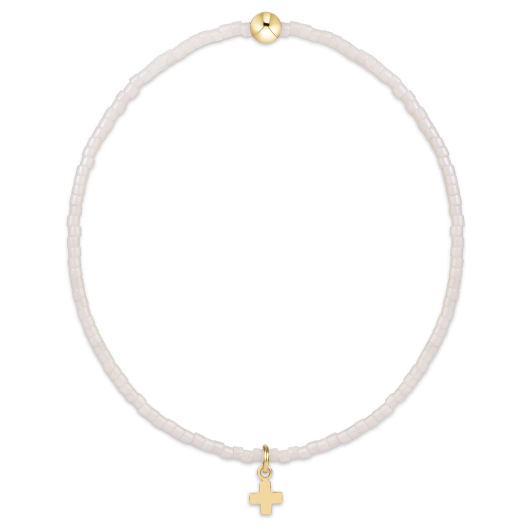 Enewton Hope Classic Signature Cross 26FW accessory in a milk finish, featuring a classic cross design