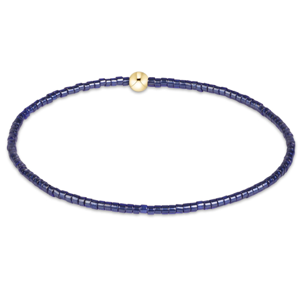 Enewton Hope Classic Bracelet 26FW accessory featuring a stylish design with delicate chain and emblem details.