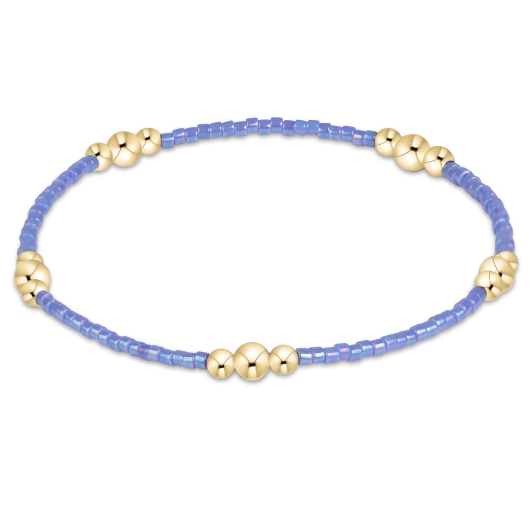 Enewton Hope Purpose gold bracelet with intricate design, featuring a 26FW accessories collection, shown on a neutral background.