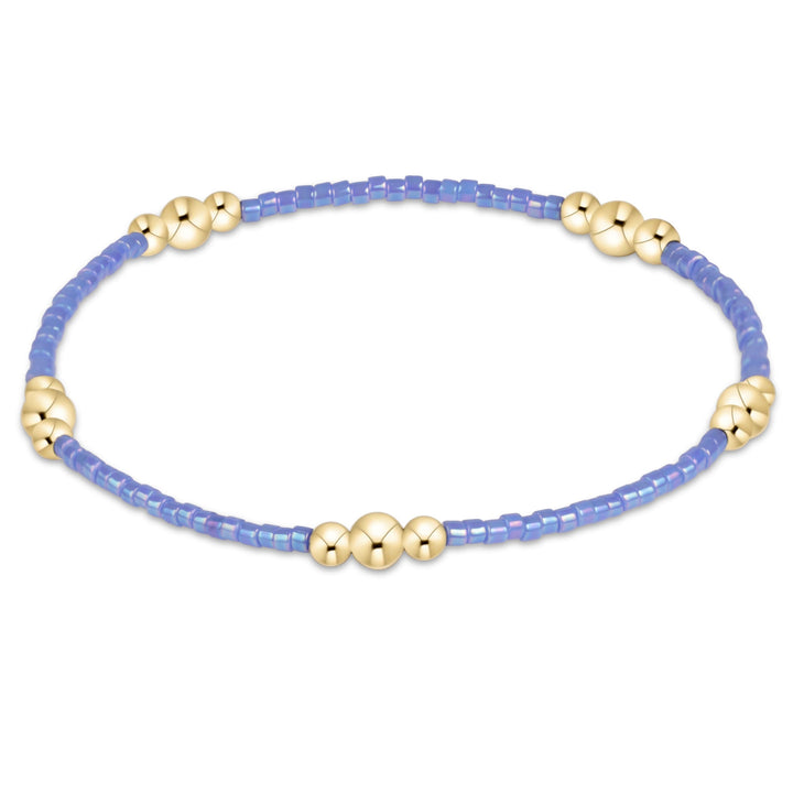 Enewton Hope Purpose gold bracelet with intricate design, featuring a 26FW accessories collection, shown on a neutral background.