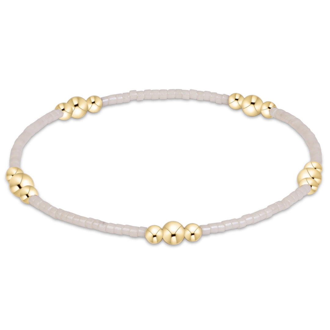 Enewton Hope Purpose Gold Bracelet 26FW, elegant jewelry accessory with a sleek gold finish, displayed on a neutral background.