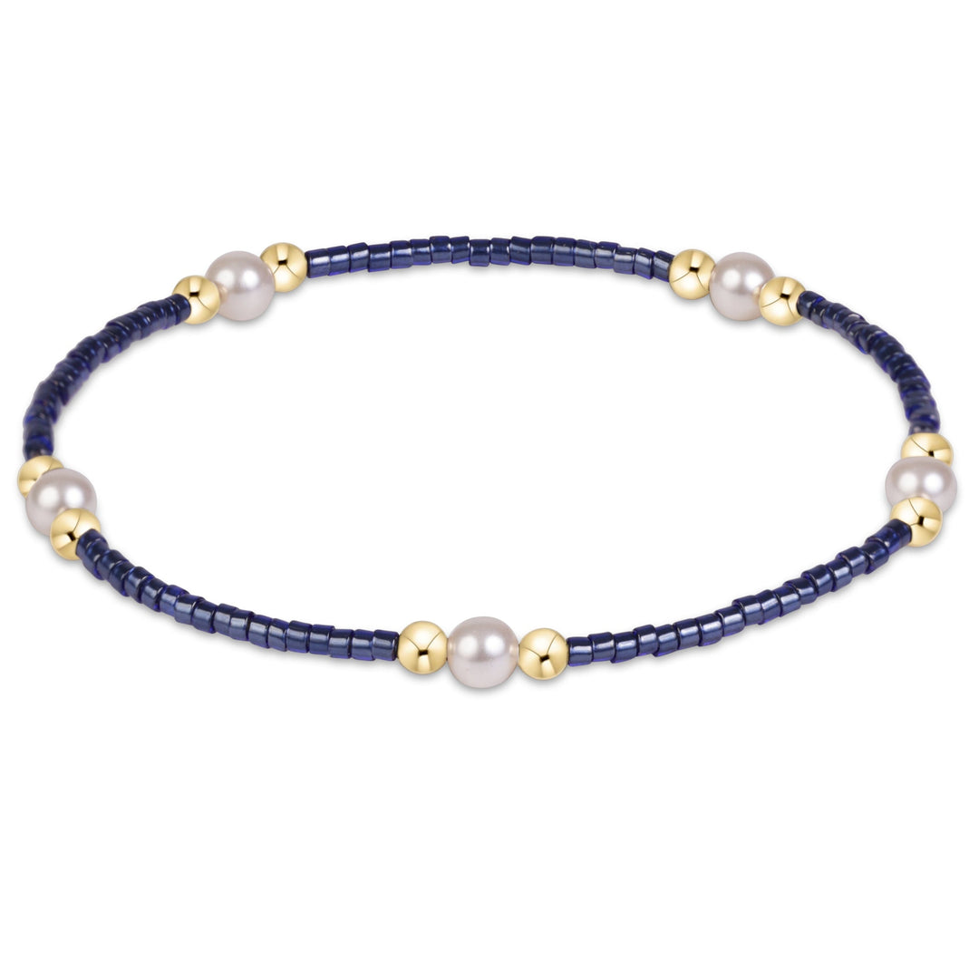 Enewton Hope Purpose Pearl Bracelet 26FW featuring elegant white pearls and silver accents, designed as stylish accessories.