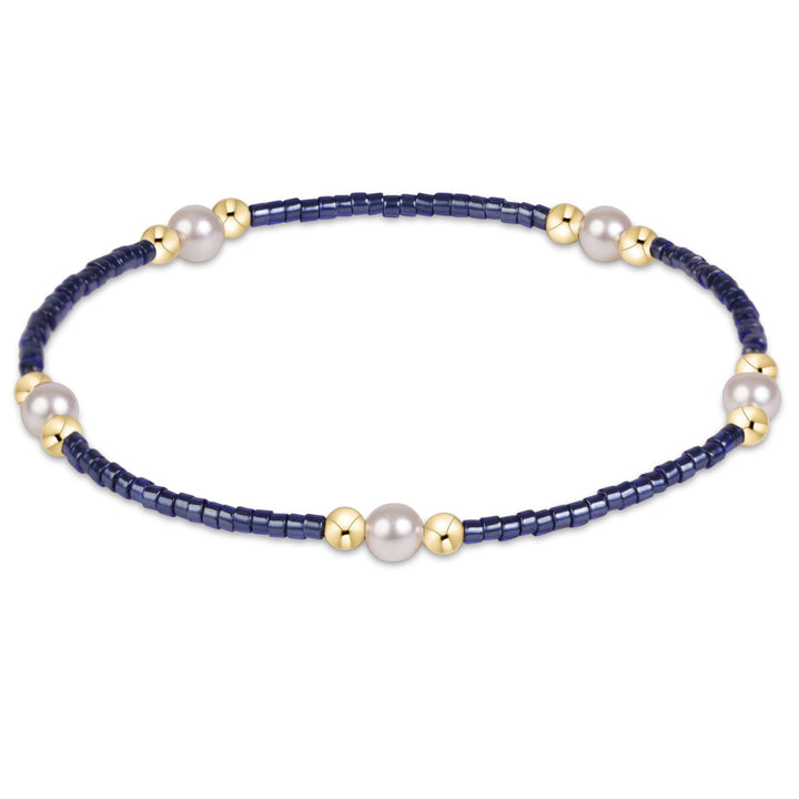 Enewton Hope Purpose Pearl Bracelet 26FW featuring elegant white pearls and silver accents, designed as stylish accessories.