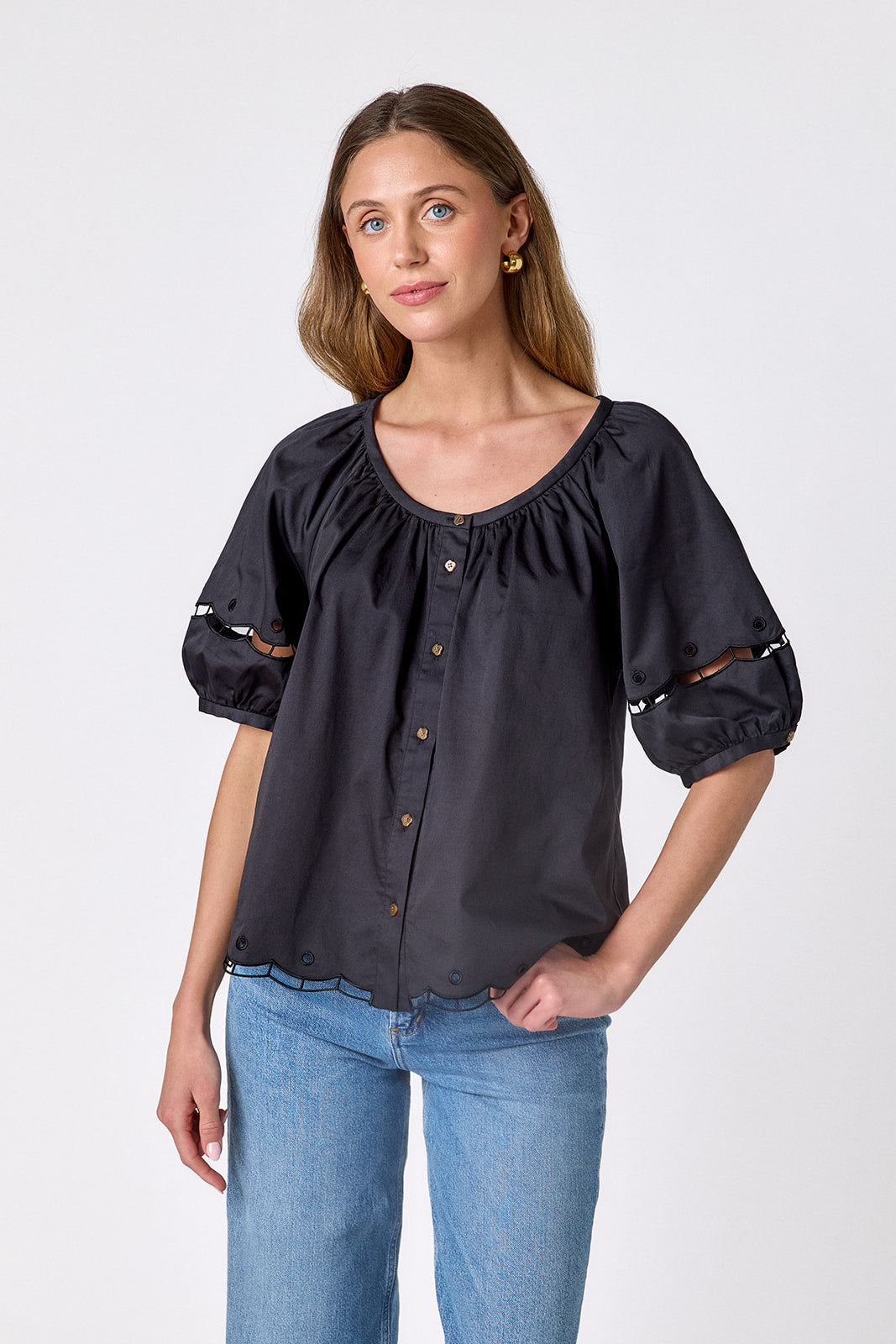 Black Crosby by Mollie Burch Perrie Top with a fitted silhouette and short sleeves, displayed on a mannequin.
