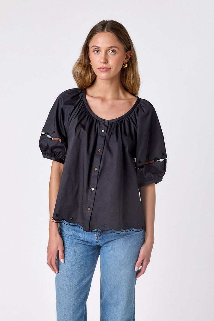 Black Crosby by Mollie Burch Perrie Top, stylish women's top with a sleek design, shown on a model.