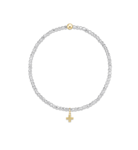 Silver bracelet with a gold charm on a white background