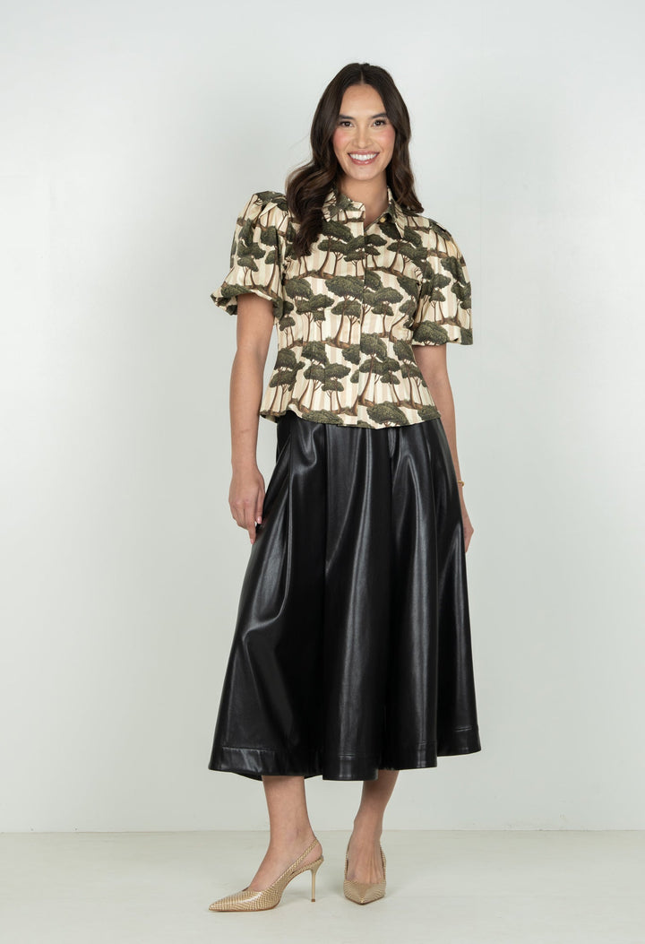 Emily McCarthy Britt Top in Umbrella Pine, front view showing stylish sleeveless design and vibrant fabric.