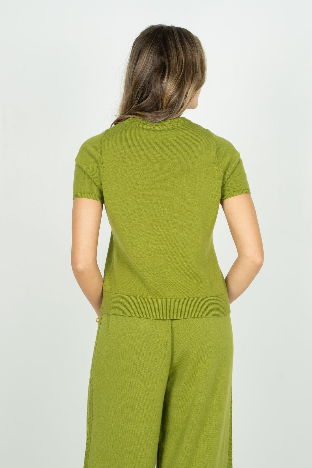 Back view of Emily McCarthy Joy Tee, a stylish tops garment in cardamom color with a relaxed fit and contemporary design.