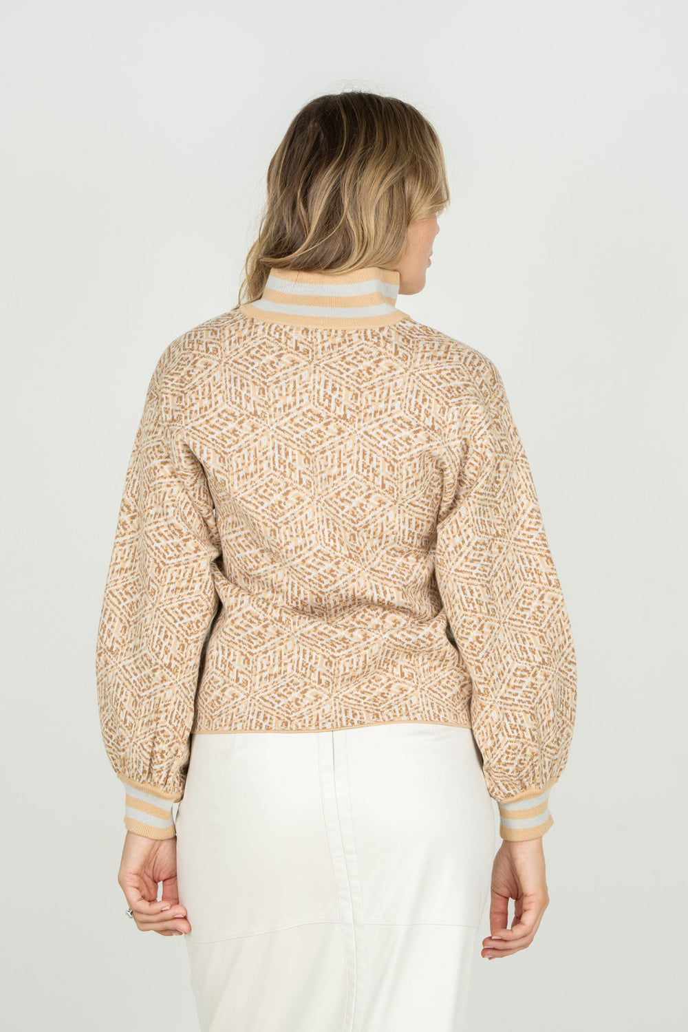 Emily McCarthy Lolli Sweater featuring a mosaic monogram design, displayed from the back view.