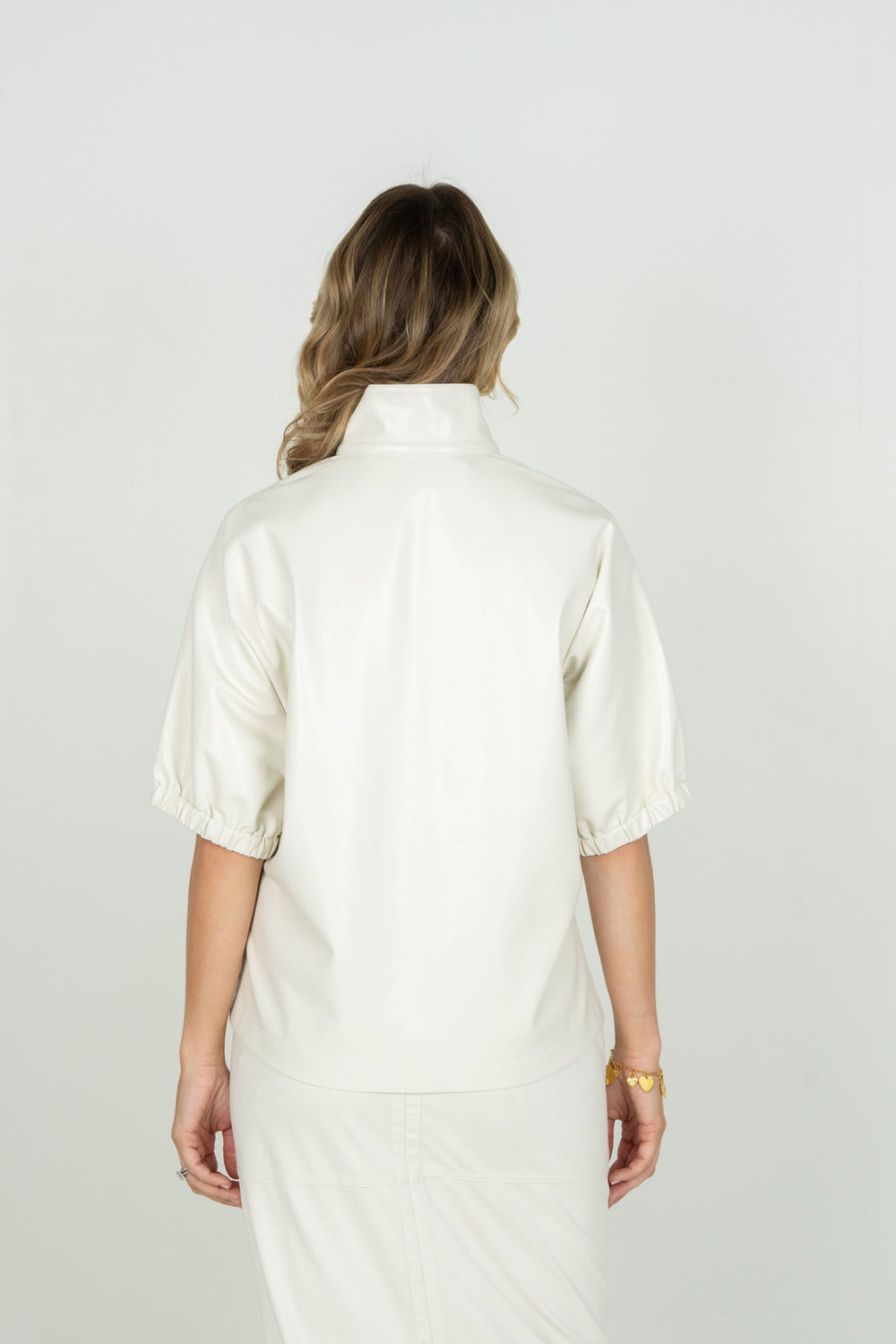 Emily McCarthy Poppy Top in Carrara, back view, showcasing stylish design and fabric details of this trendy tops piece.