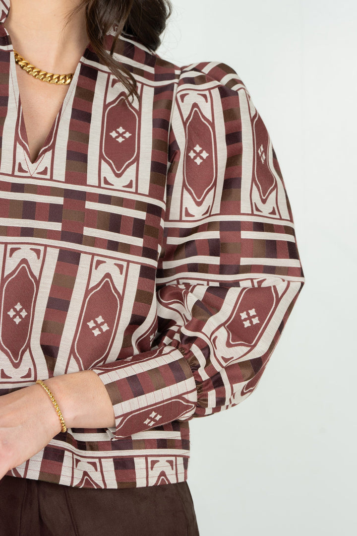 Close-up of the Emily McCarthy Hampton Duomo Jacquard Top showing intricate fabric pattern and detailed craftsmanship.