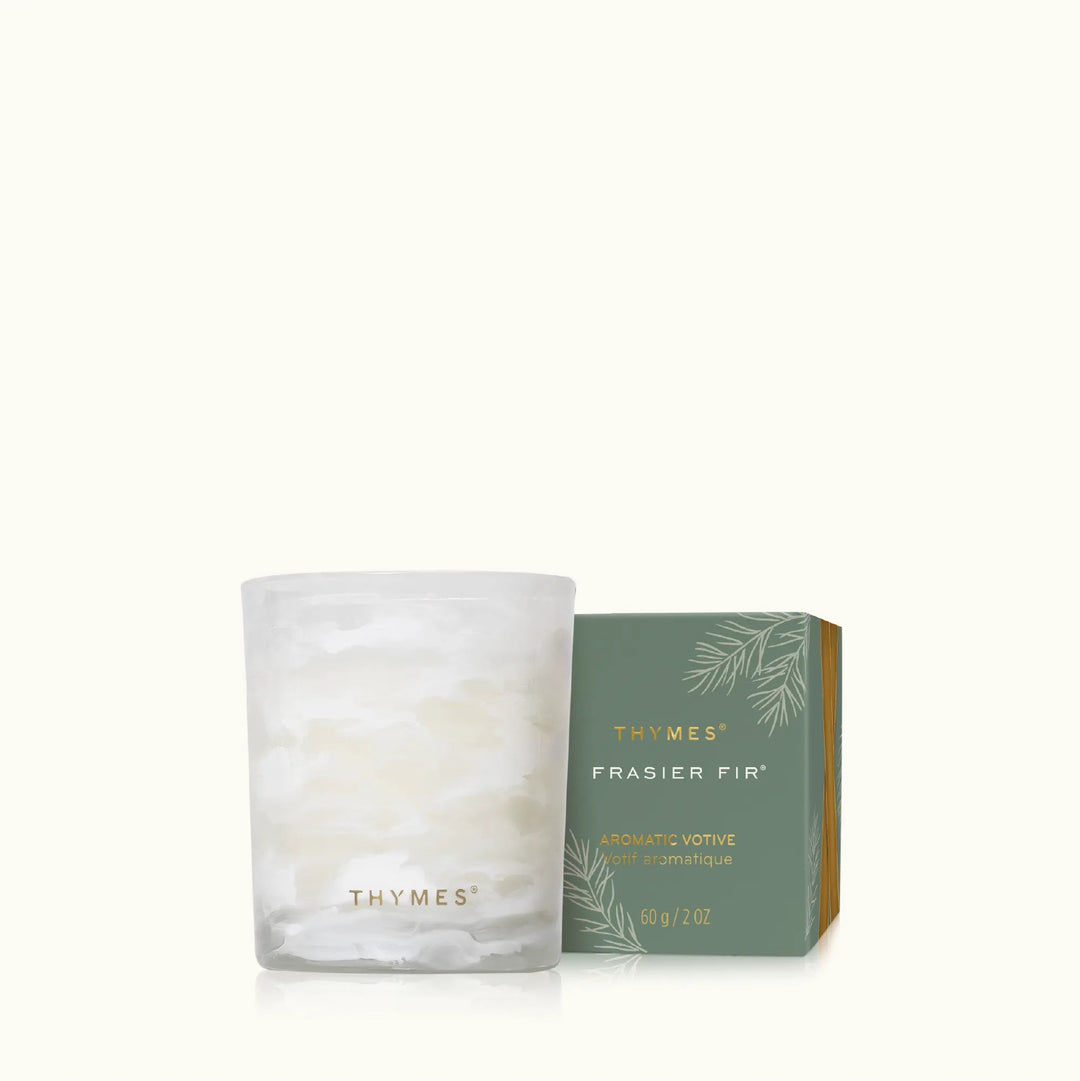 Thymes Tidings Boxed Votive candle in a decorative holder, perfect for home décor and creating a cozy ambiance.