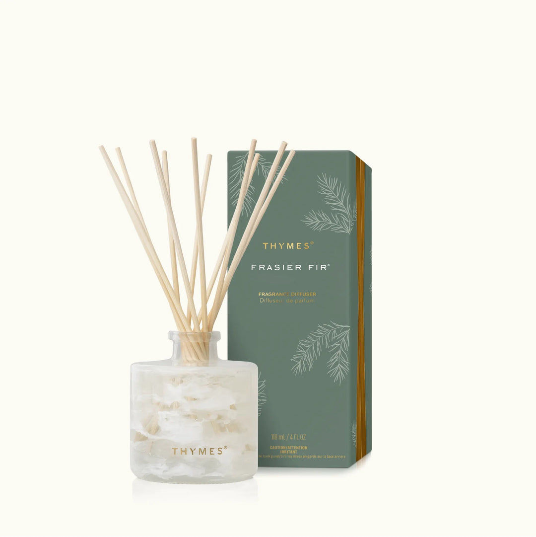 Thymes Tidings Petite Diffuser in a sleek home decor design with reed sticks, suitable for adding fragrance to your space.