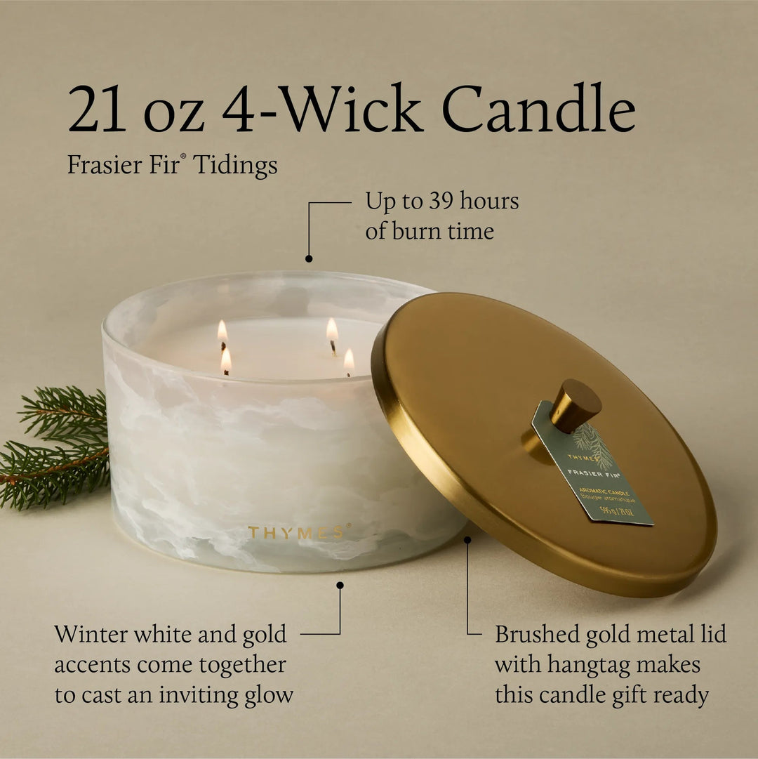 Thymes Tidings 4-wick candle in a decorative jar with a festive holiday label, designed for home ambiance.