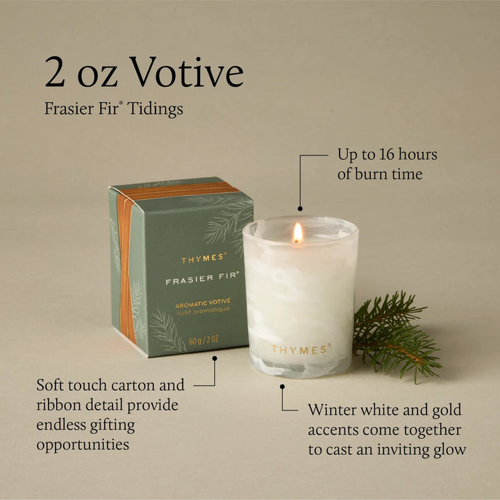 Thymes Tidings Boxed Votive candle in a decorative container, suitable for home decor and creating a cozy ambiance.