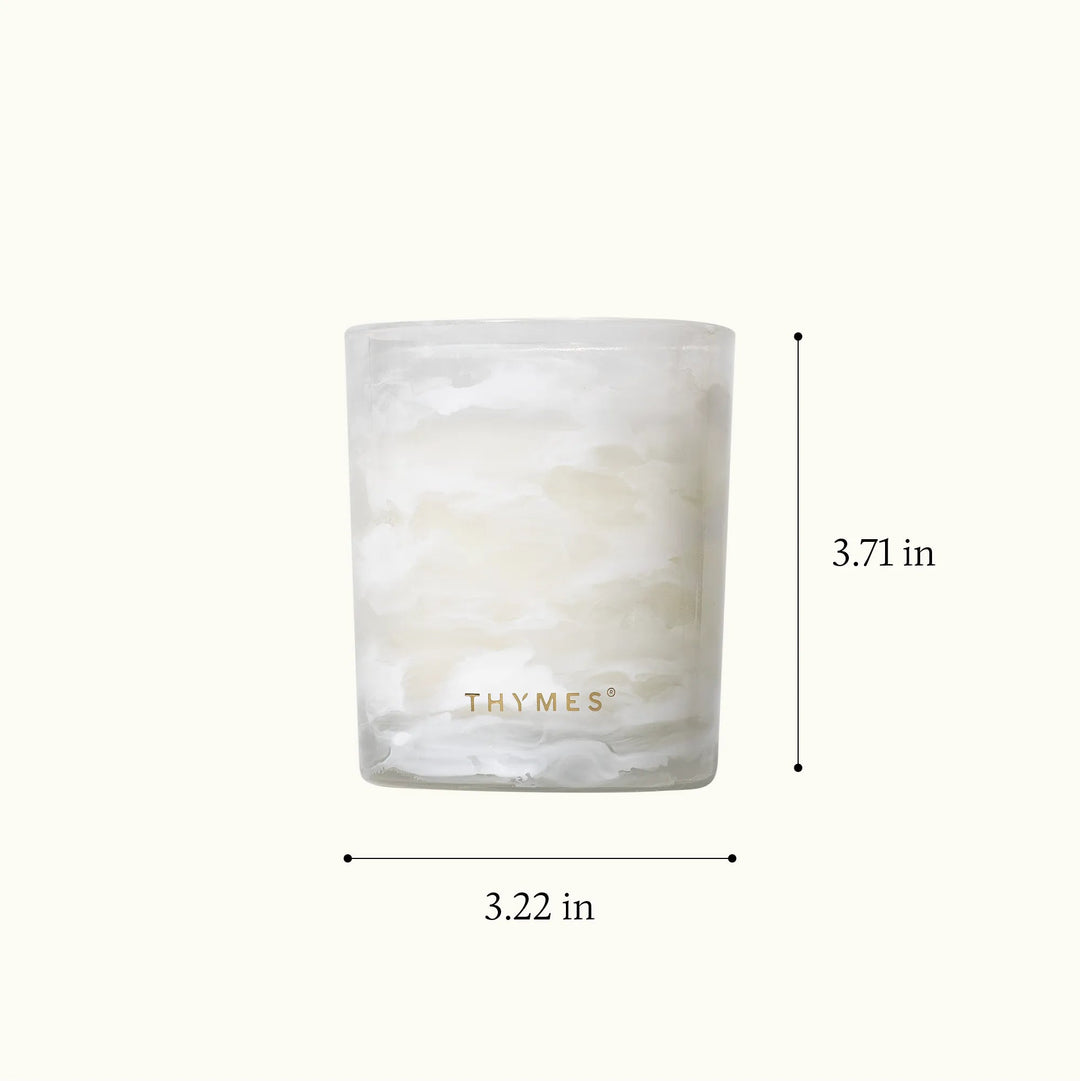 Thymes Tidings boxed candle with decorative packaging, perfect for home decor and creating a cozy atmosphere.