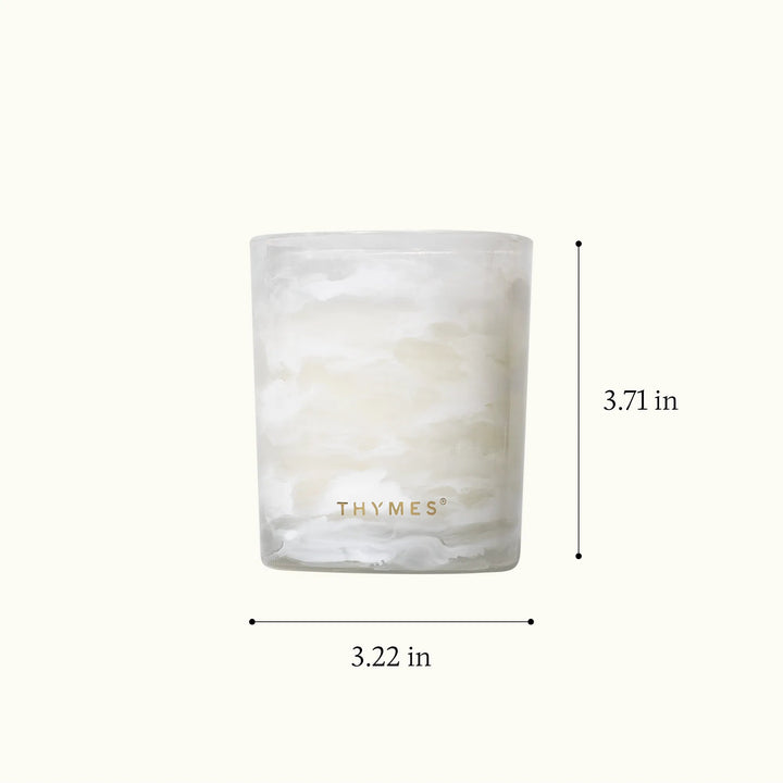 Thymes Tidings boxed candle with decorative packaging, perfect for home decor and creating a cozy atmosphere.