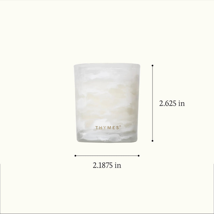 Thymes Tidings Boxed Votive candle in a decorative holder, perfect for home decor and creating a cozy atmosphere.