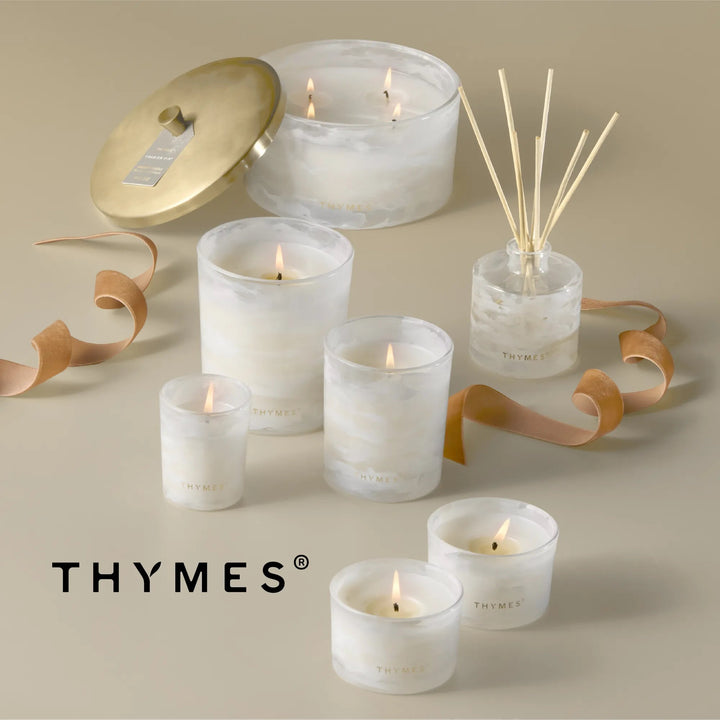 Thymes Tidings Petite Diffuser with decorative glass bottle and reed sticks for home fragrance.