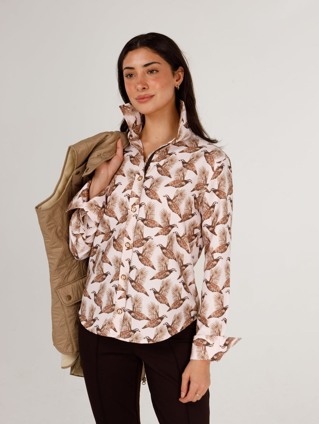 Holly Shae Quail Stripe Liz Top featuring a stylish striped pattern and relaxed fit, displayed on a hanger.