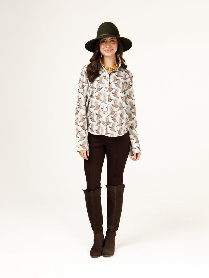 Holly Shae Quail Stripe Liz Top in brown and green with a striped pattern, displayed on a hanger.