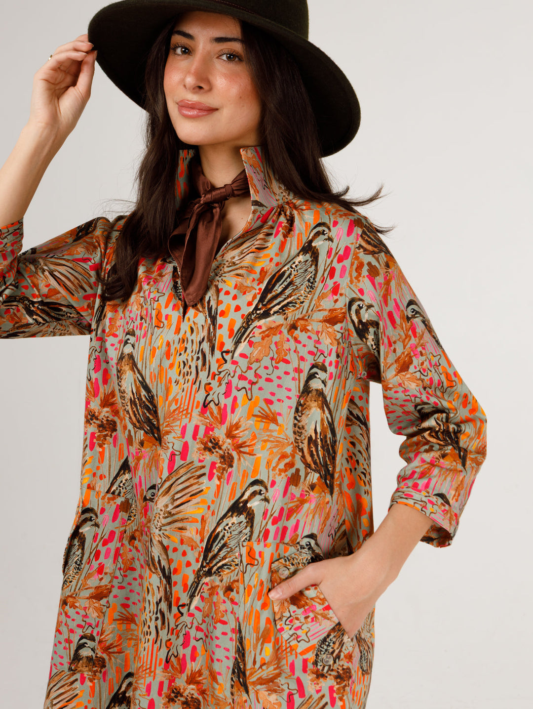 Holly Shae Wildwood Wing Madi dress displayed on hanger, featuring flowy fabric and intricate floral details.