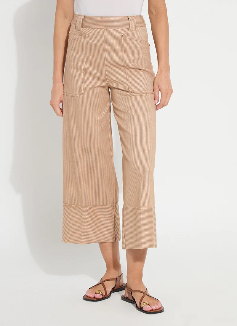 Lysse Analia Wide Leg Denim jeans hanging on a rack with a high waist and relaxed fit, showcasing their wide leg design.