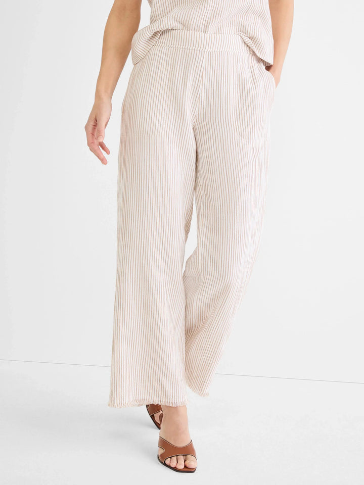 Light beige pinstripe gauze pant from Nic & Zoe featuring a relaxed fit and elastic waistband, styled as casual bottoms.