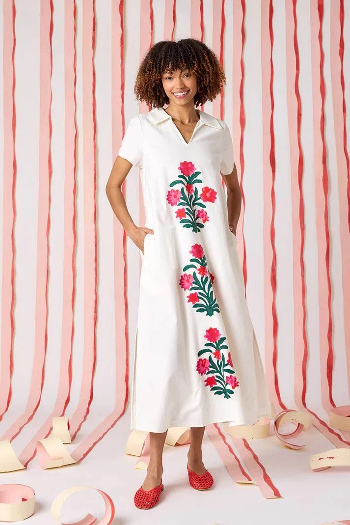 Crosby by Mollie Burch Franny Dress in floral print, featuring short sleeves and a flowy silhouette, displayed on a hanger.