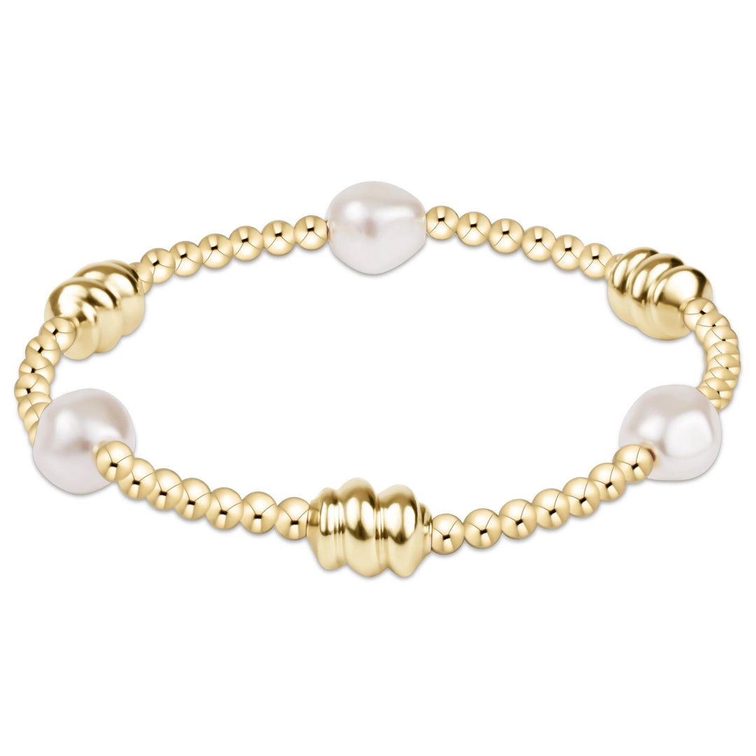 Enewton Admire Gold and Pearl 3mm gold bracelet featuring a delicate design with gold links and pearl accents.