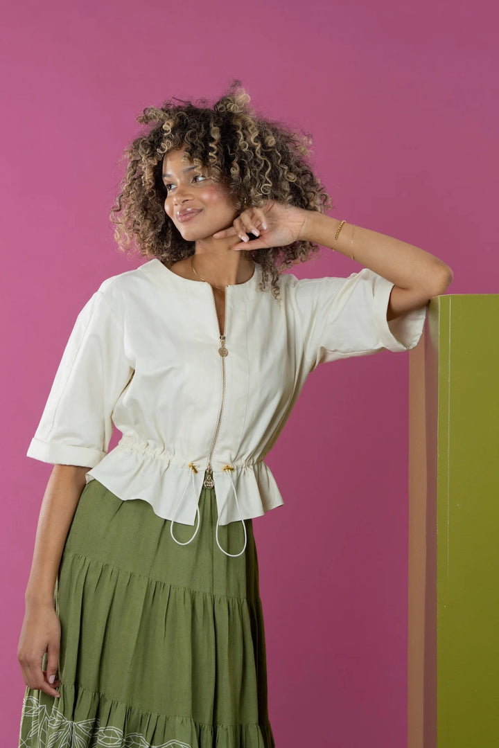 Emily McCarthy Cloud Chambray Jacket worn by a woman, showcasing its relaxed fit and soft fabric against a neutral backdrop.