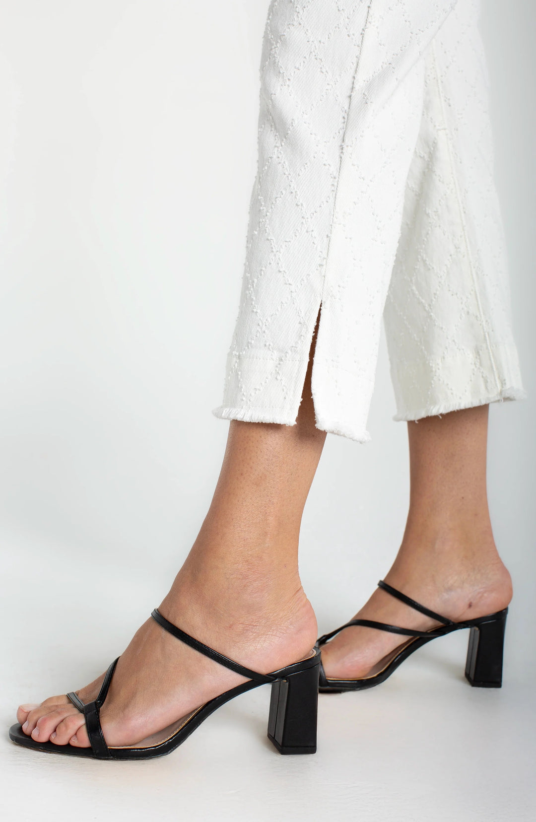Liverpool Hannah Crop Flare bottoms with wide fray hem and slit, in white diamond color, showcasing trendy style and casual fit.