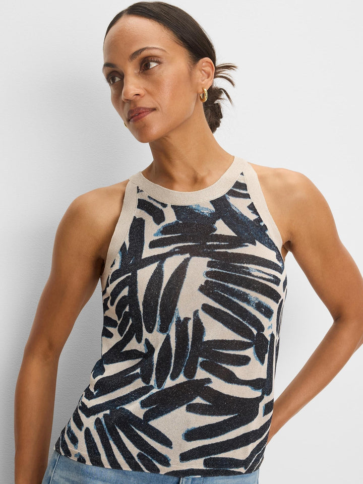 Woman wearing the Painted Palms Sweater Tank by Nic & Zoe, featuring a colorful palm print and sleeveless design.