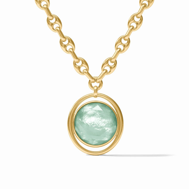 Julie Vos Laguna statement necklace with layered gold-toned accessories and intricate design details.