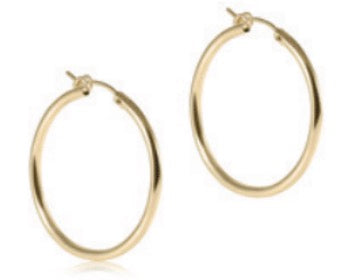 Round gold 1.25-inch hoop earrings by Enewton with a smooth finish, showcasing their shiny, minimalist jewelry design.