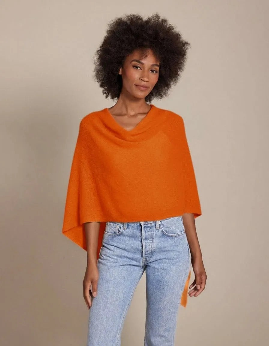 Alashan Cashmere cashmere topper shown as a soft, luxurious tops garment in a neutral color, displayed on a hanger.