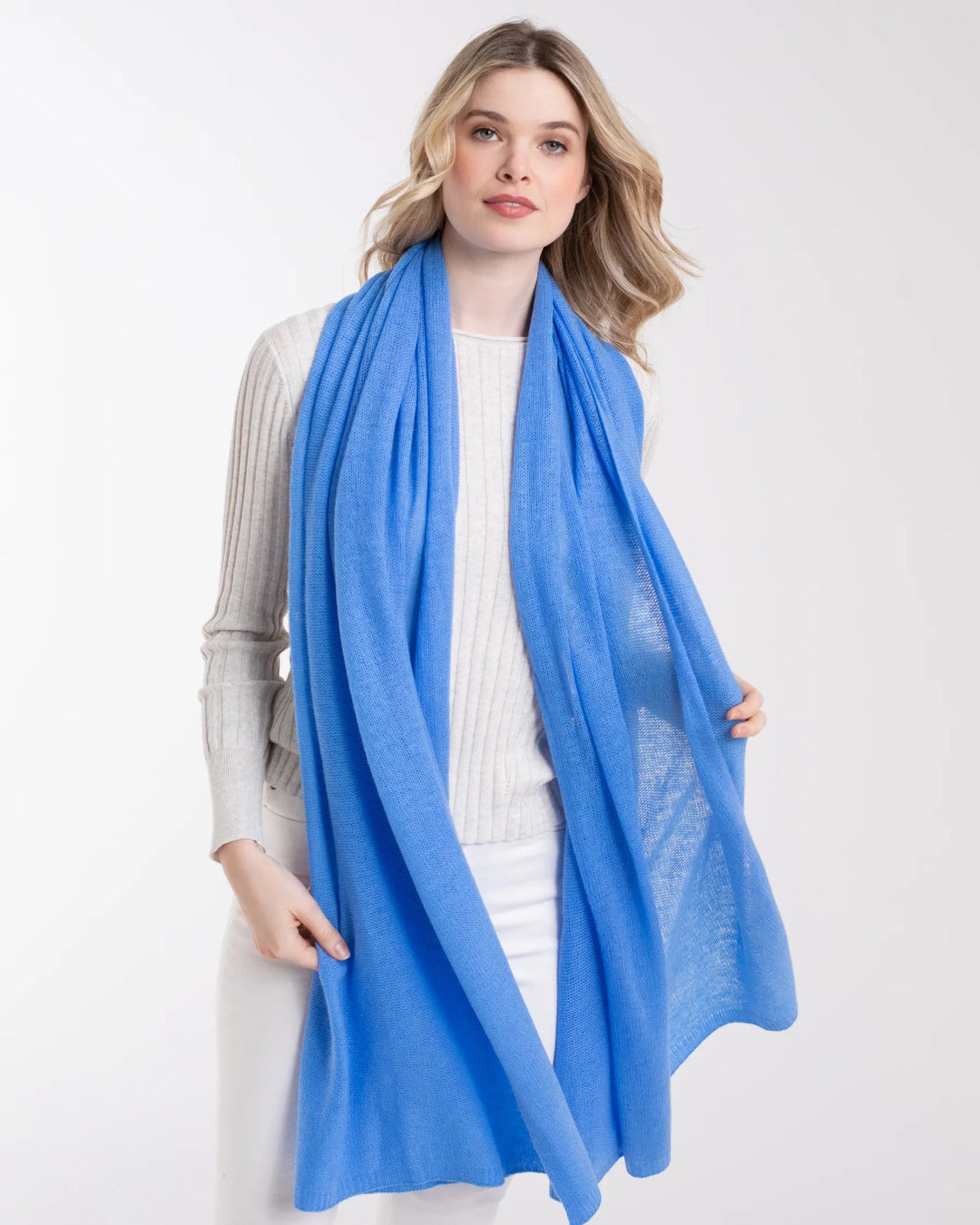 Alashan Cashmere travel wrap in soft 100% cashmere, draped over a neutral-colored top, showcasing its luxurious texture and elegant design.