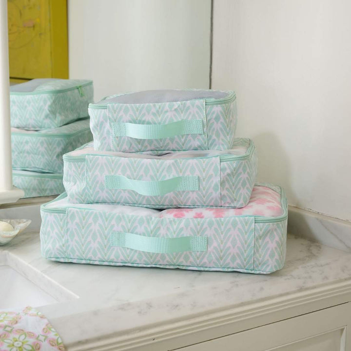 Laura Park Designs mint packing cubes set, compact and organized travel accessories for efficient packing.