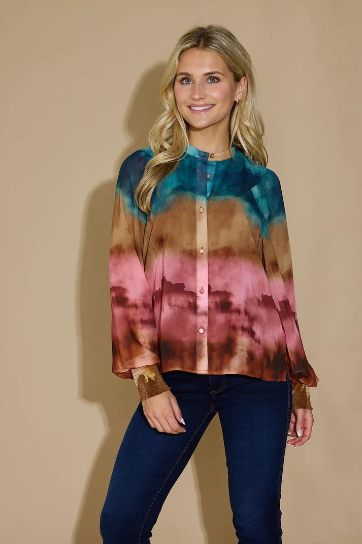 Alden Adair Cece Mesa Top in a stylish, patterned blouse with a relaxed fit, displayed on a hanger against a neutral background.