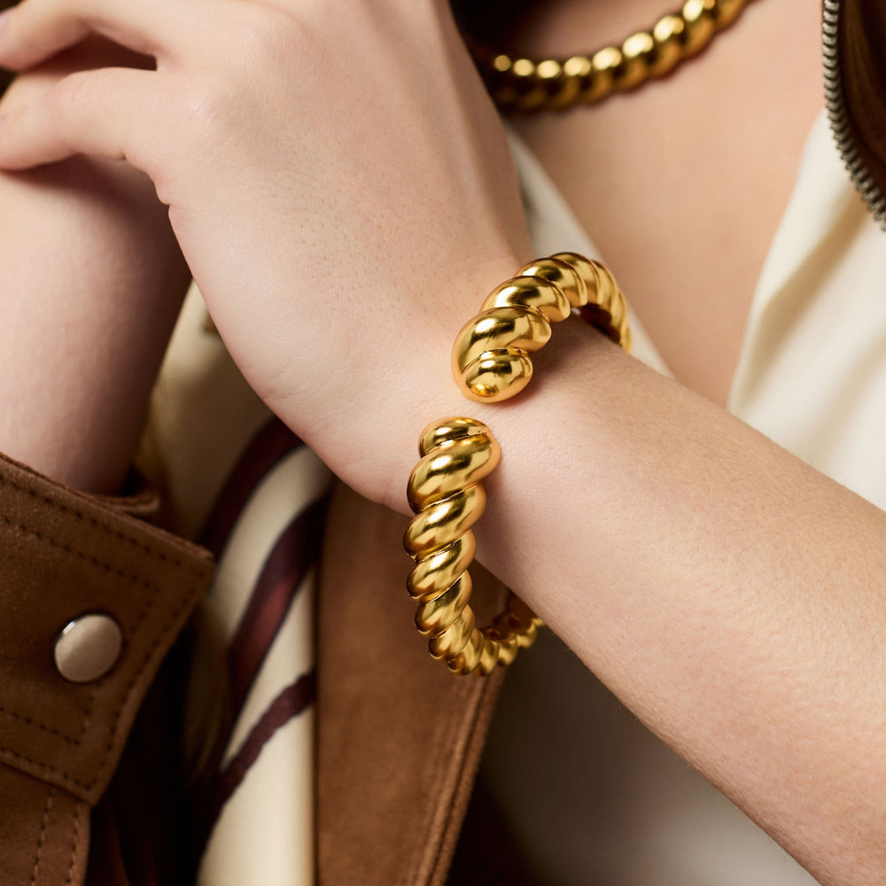 Golden Julie Vos Ravello cuff bracelet with intricate design and elegant detailing, styled as a stylish accessories piece.