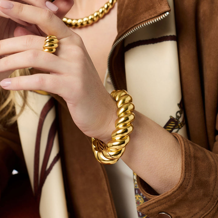 Gold Ravello Statement Hinge Bangle by Julie Vos, showcasing a stylish and bold jewelry accessory.