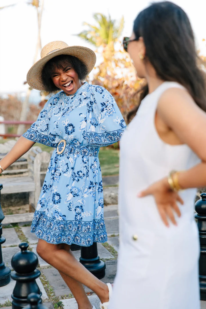 woman in floral sail to sable dress