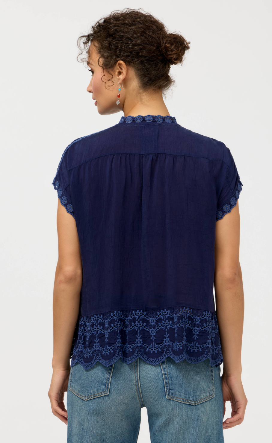 Johnny Was Astrud Romana blouse featuring flowy fabric and intricate patterns, styled as a stylish women's top.