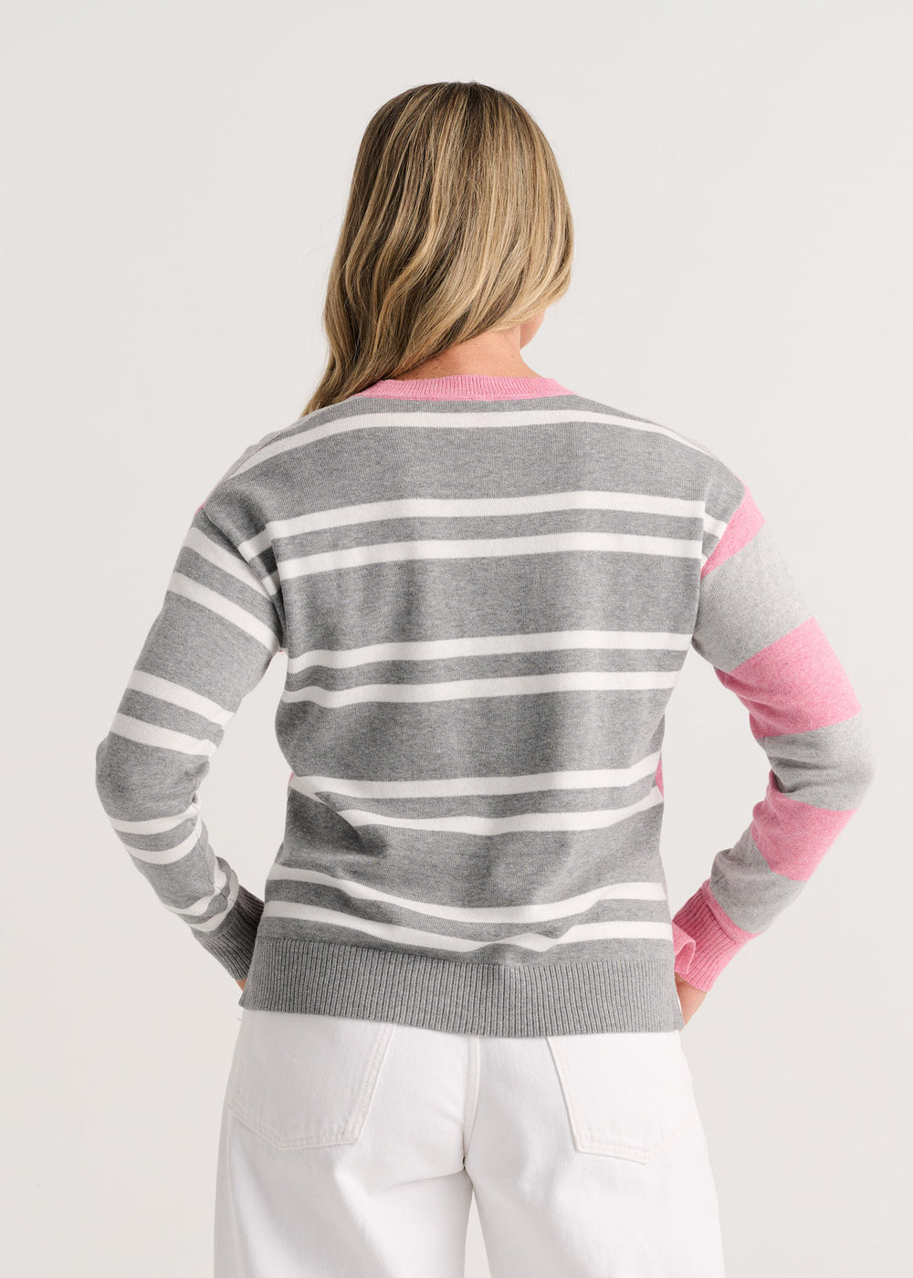 Heather pink bold stripe sweater by Zaket & Plover, featuring a cozy knit top with vibrant pink and contrasting stripes.