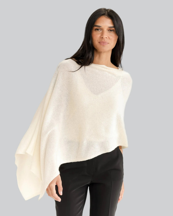 Soft beige Alashan Cashmere topper top, lightweight and luxurious, shown draped on a neutral background.