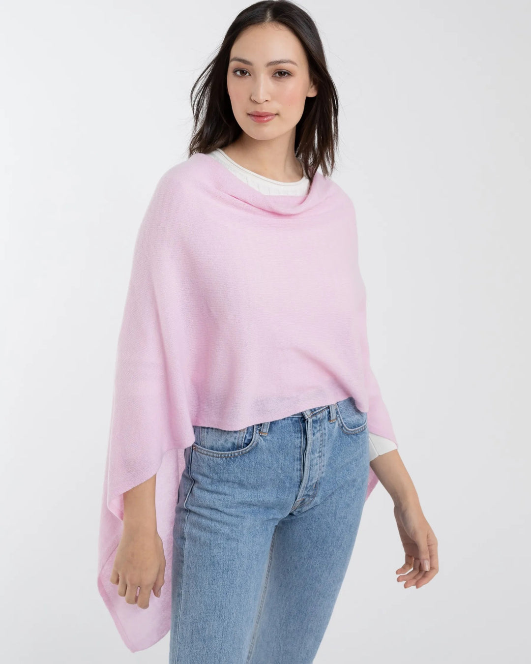 Alashan Cashmere cashmere topper shown draped over a top, highlighting soft, luxurious fabric and elegant design.